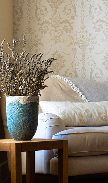 Logis-de-Tirac-cream-bedroom - Lavender in pot and a comfy sofa