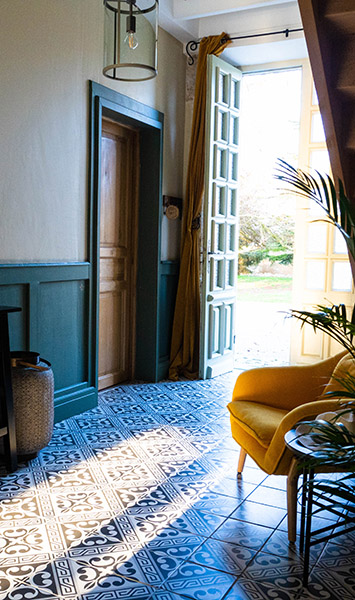 Logis-de-Tirac-hallway - Yellow chair with sunshine
